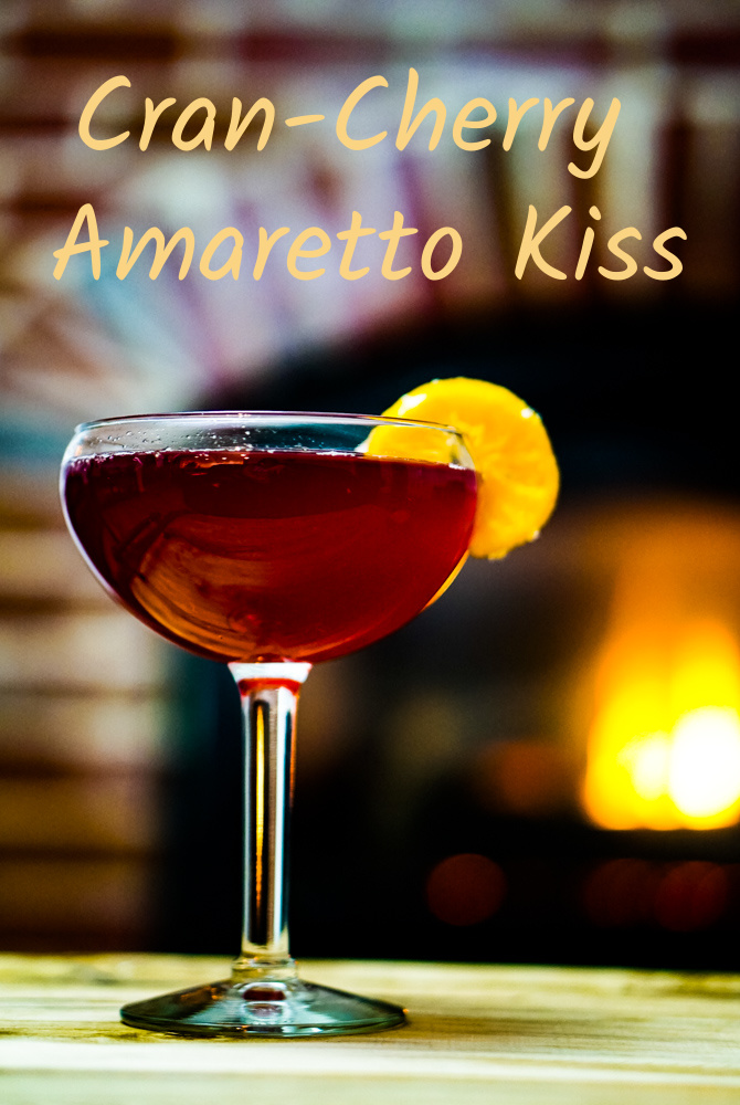 Cran-Cherry Amaretto Kiss has a unique twist of cherry juice to enhance the amaretto. It pulls the flavors together so that this drink dances across your tongue and makes your lips smile. .~By Wet Whistle Drinks by Darla Bentley
