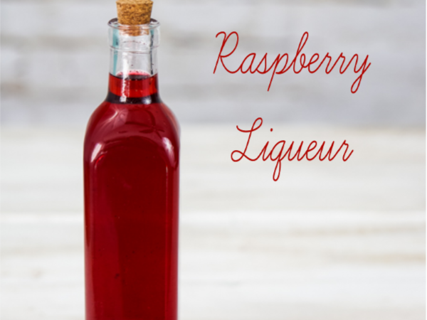 This homemade raspberry vodka liqueur is tasty enough to drink straight! The vanilla beans and frozen raspberries beautifully flavor your favorite vodka. ~By Wet Whistle Drinks by Darla Bentley
