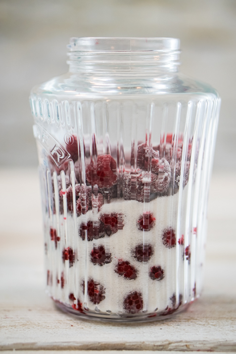 This homemade raspberry vodka liqueur is tasty enough to drink straight! The vanilla beans and frozen raspberries beautifully flavor your favorite vodka. ~By Wet Whistle Drinks by Darla Bentley