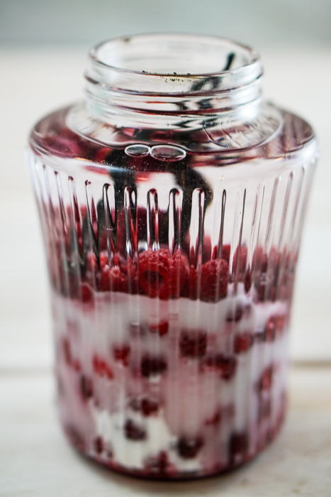 This homemade raspberry vodka liqueur is tasty enough to drink straight! The vanilla beans and frozen raspberries beautifully flavor your favorite vodka. ~By Wet Whistle Drinks by Darla Bentley