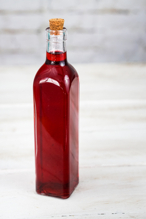 This homemade raspberry vodka liqueur is tasty enough to drink straight! The vanilla beans and frozen raspberries beautifully flavor your favorite vodka. ~By Wet Whistle Drinks by Darla Bentley