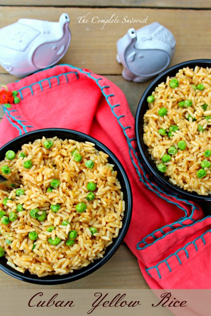 Cuban yellow rice with peas, cloth napkins, and white elephant salt and pepper shakers